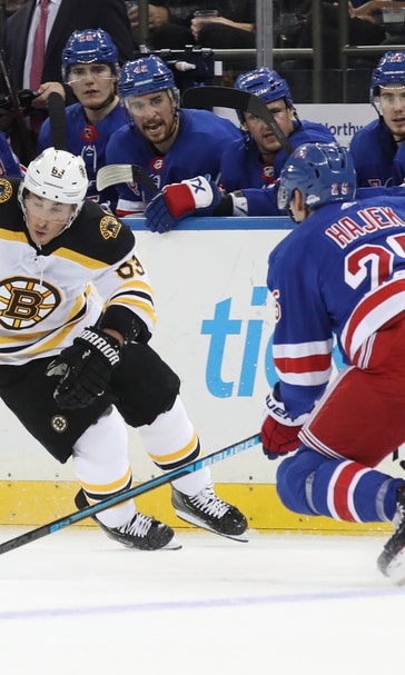 Marchand, Bergeron lead Bruins to 7-4 win over Rangers